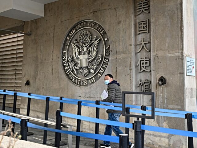 embassy building In this picture taken on December 10, 2021, a man visits the US embassy in Beijing. (Photo