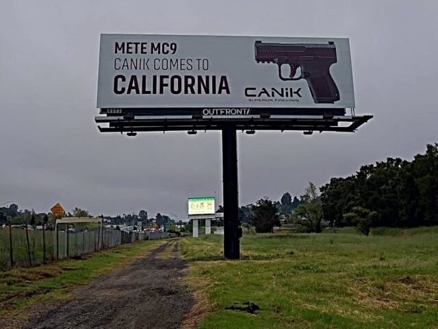 An Oakland, California, billboard showing a compact, California-compliant CANIK 9mm pistol