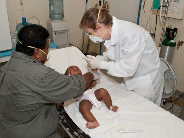 pexels-cdc-library-3993239 baby-lying-down-on-hospital-bed-getting-a-check-up