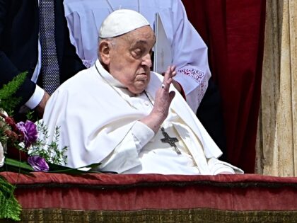 Pope Francis waves from the main balcony of St. Peter's basilica for the Urbi et Orbi mess