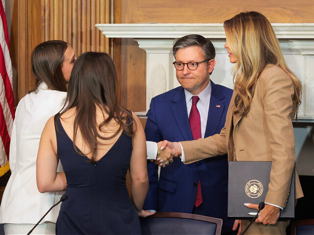 WASHINGTON, DC - MARCH 03: U.S. first lady Melania Trump (R) shakes hands with Francesca M