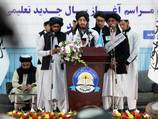 talibanists Taliban students wearing salwar kameez, sing tarana during a ceremony held to mark the sta