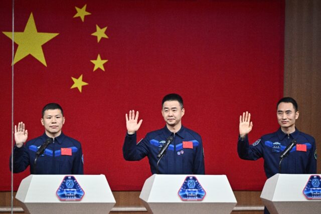 Astronauts for China’s Shenzhou-20 space mission (L-R) Wang Jie, Chen Dong and Chen Zhon