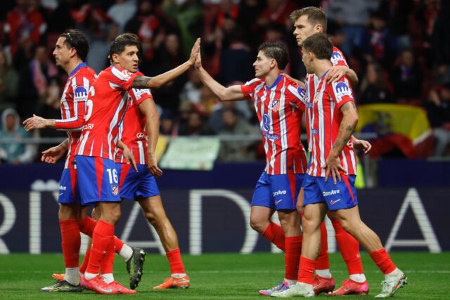 Atletico Madrid's Argentine forward Julian Alvarez (3R) celebrates scoring his team's thir