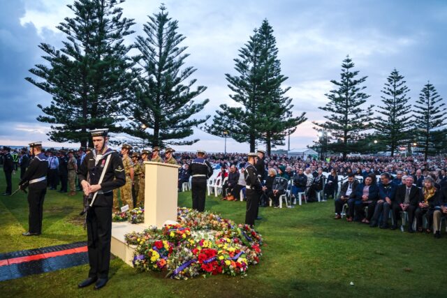 Australians and New Zealanders gathered just before dawn to observe solemn Anzac Day cerem