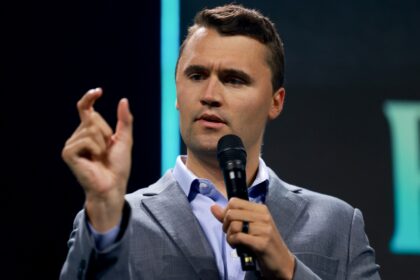 Charlie Kirk, who founded Turning Point USA, speaks before former President Donald Trump's