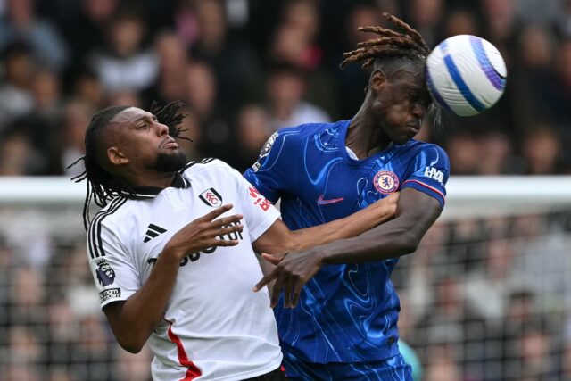 Chelsea defender Trevoh Chalobah (R) wins an aerial duel against Fulham midfielder Alex Iw