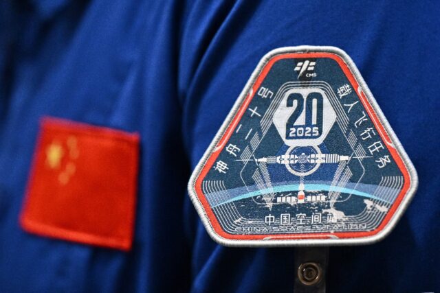 Three Chinese astronauts returned to Earth on Wednesday after six months on the country's