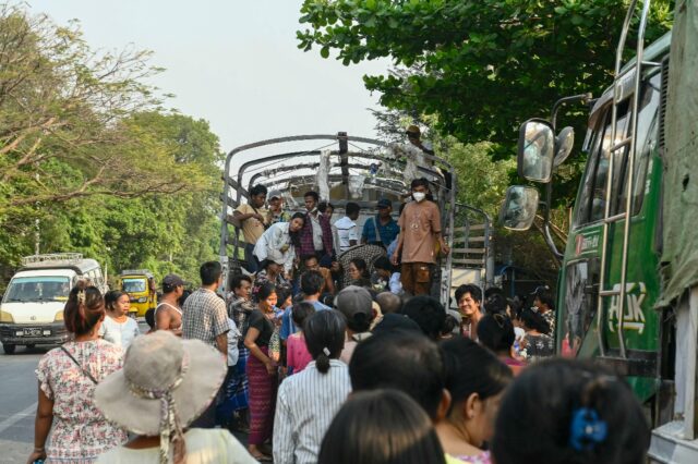 Crowds jostled through traffic and braved scorching heat in a race to secure vital aid in