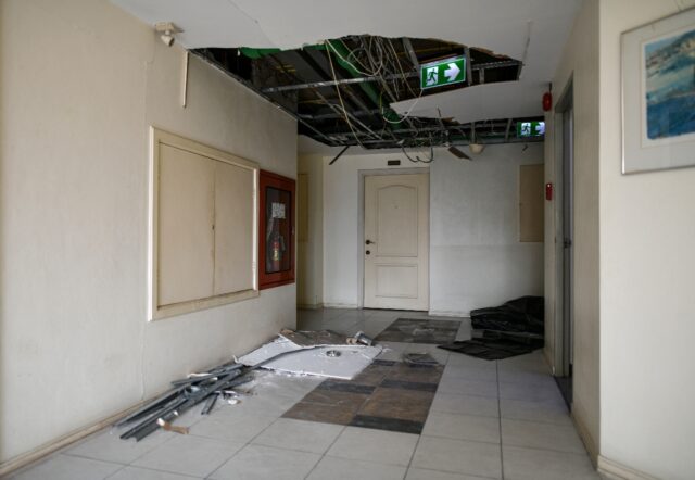 A damaged corridor inside a high-rise residential condominium in Bangkok after the March 2