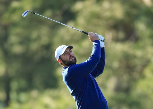 Defending champion Scottie Scheffler plays a shot in the second round of the Masters at Au