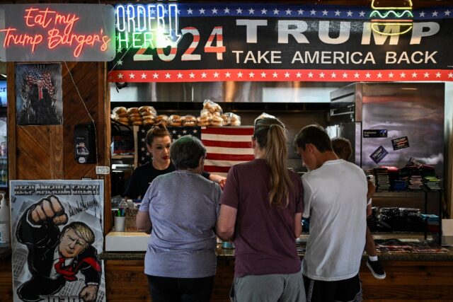 Diners in Bellville, Texas place their orders at the Trump Burger restaurant, where images