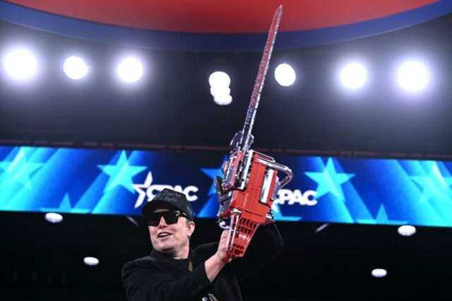 Elon Musk holds a chainsaw to symbolize his radical cuts of the US government