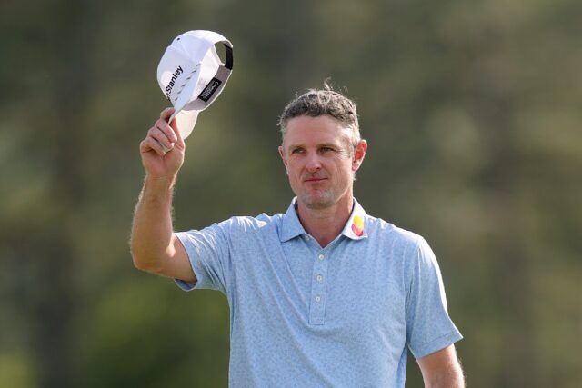 England's Justin Rose salutes fans after taking the first-round lead at the Masters at Aug