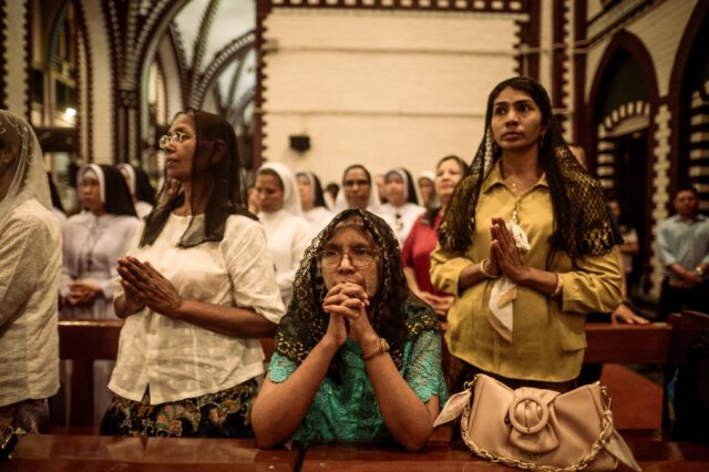 Faithful pray in memory of the late Pope Francis at St Mary’s Cathedral in Yangon