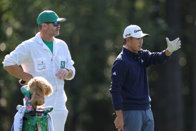 Fourth-ranked Collin Morikawa, right, speaks with his caddie Jonathan Jakovac during a pra