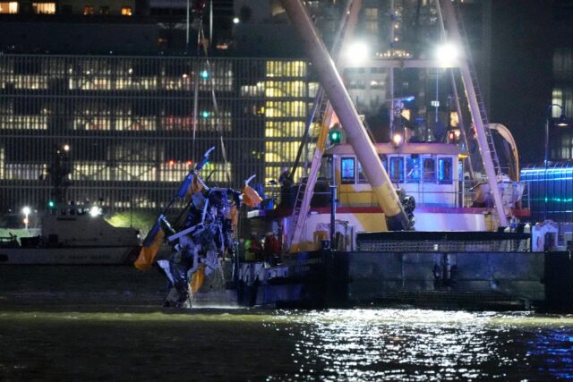 Images showed the cockpit of the passenger helicopter being lifted from the river by a bar