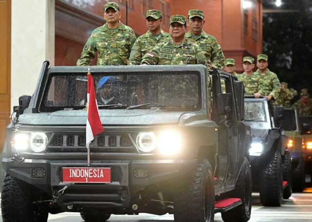 Indonesia's President Prabowo Subianto (3L) at the military academy during their cabinet r
