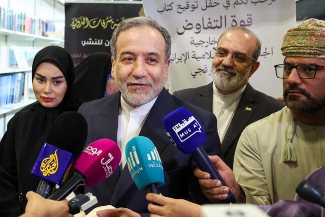 Iran's Foreign Minister Abbas Araghchi speaks to the reporters at the Muscat International