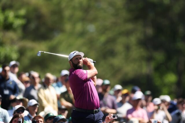Former Jon Rahm of Spain plays a shot during a practice round before the 2025 Masters at A