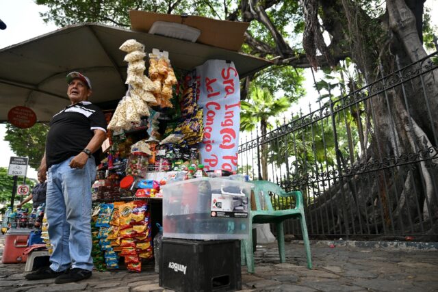 Juan Carlos Pesantes speaks during an interview with AFP next to the Seminary Park in Guay