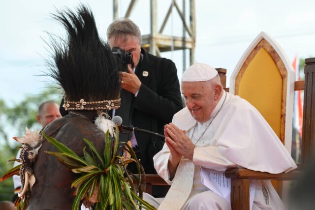 The late Pope Francis meets with the Catholic faithful in Papua New Guinea's remote jungle
