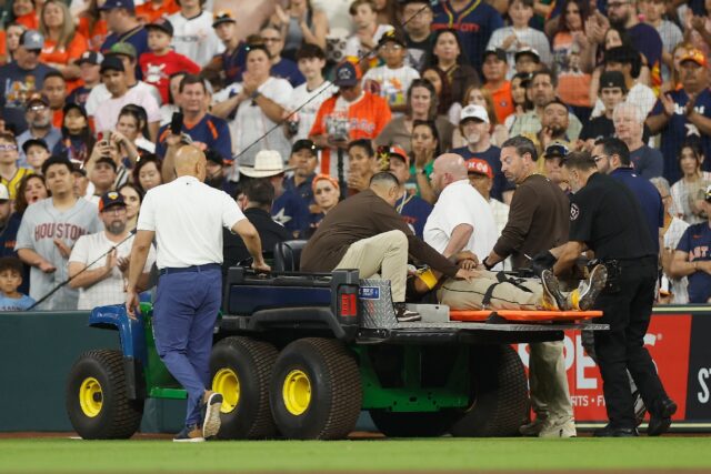 Luis Arraez of the San Diego Padres is carted off the field after colliding with Mauricio