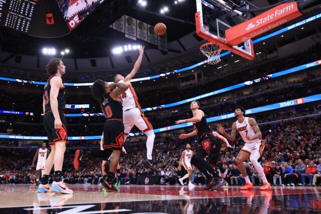 Miami's Tyler Herro shoots over Chicago's Coby White on his way to 38 points in a 109-90 p