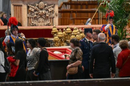 Mourners queued for up to four hours to catch a glimpse of pope Francis, dressed in in his