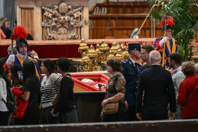 Mourners queued for up to four hours to catch a glimpse of pope Francis, dressed in in his