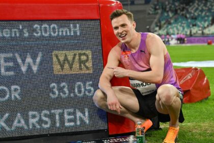 Norway's Karsten Warholm poses with his time of 33.05 seconds after he broke the men's 300