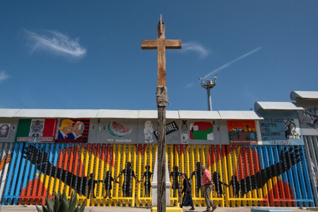 A nun visits the Mexico-US border fence in Tijuana
