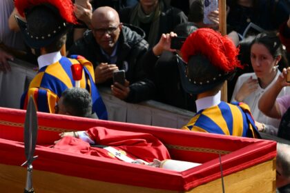 Pallbearers, next to Swiss Guards, carried the coffin of Pope Francis as it was transport