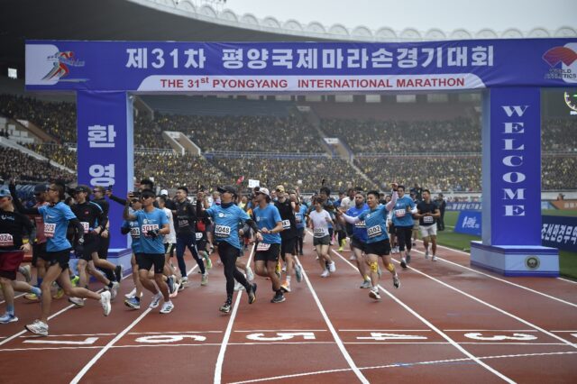 Participants take part in the 31st Pyongyang International Marathon at Kim Il Sung Stadium