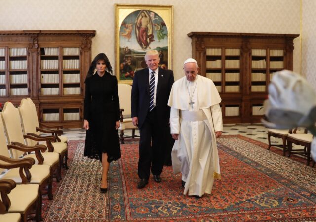 Pope Francis walks along with US President Donald Trump and US First Lady Melania Trump at