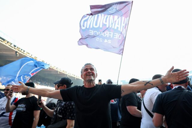 PSG coach Luis Enrique leads the celebrations after his side clinched the Ligue 1 title on