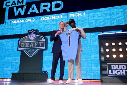 Quarterback Cam Ward, right, poses with NFL commissioner Roger Goodell after being selecte