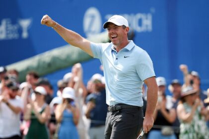 Reigning Masters champion Rory McIlroy celebrates making a 30-foot eagle putt on the 18th