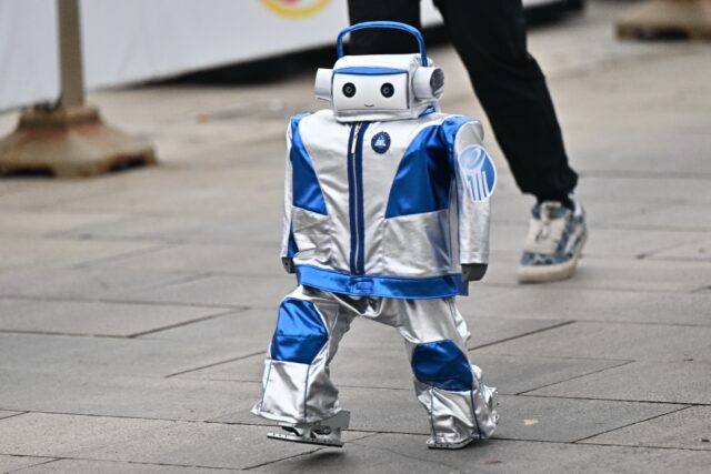 A robot takes part in the humanoid robot half marathon in Beijing on April 19, 2025