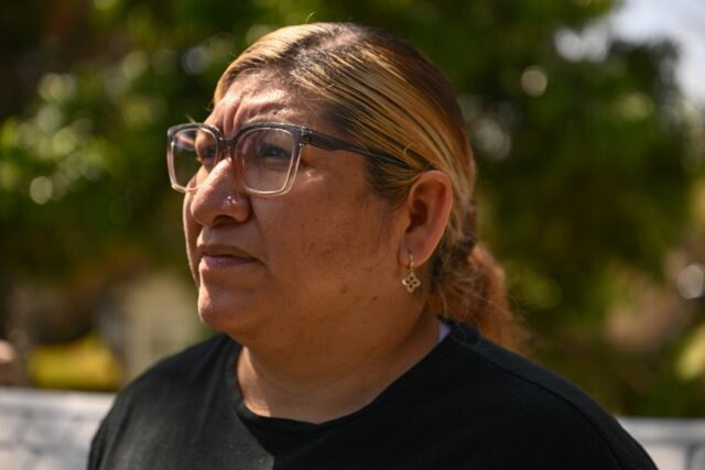 Rosalba Hernandez, an undocumented immigrant mother from Mexico, stands for a portrait out