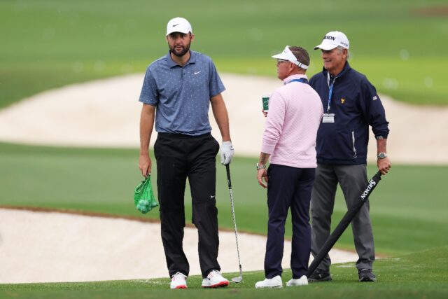 World number one Scottie Scheffler, left, talks with coaches Sean Foley, center, and Randy