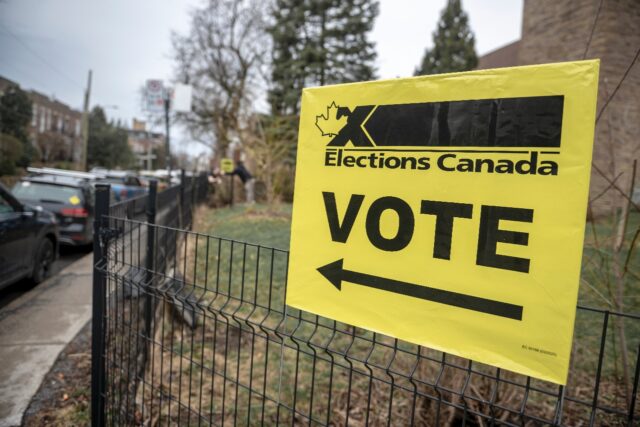 A signing directing people to an advanced voting station in Montreal, Canada on April 19,