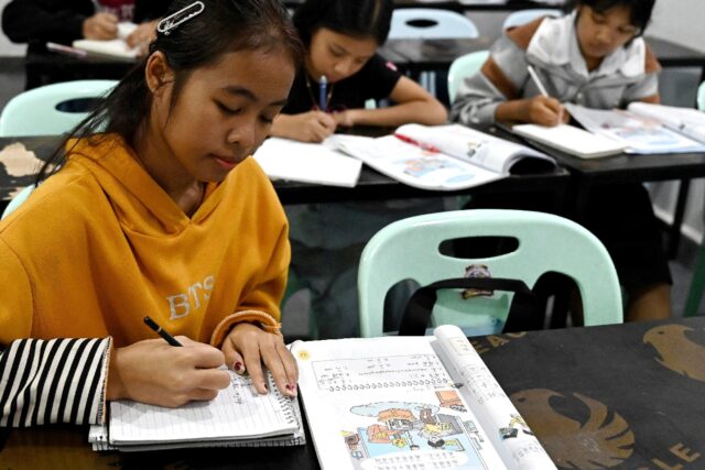 Students learning Mandarin inside a classroom at the Tai Zhong No.2 Chinese school in Siha