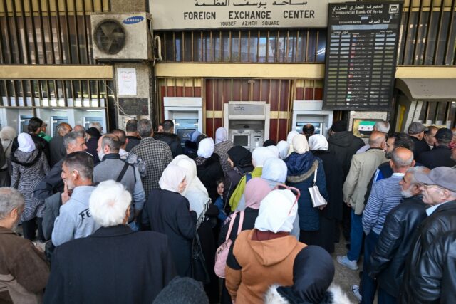Syrian civil servants must queue at one of two state banks or affiliated ATMs, and withdra