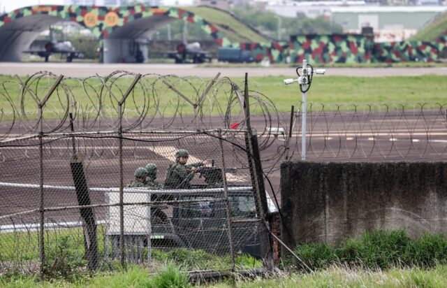 Taiwanese forces at Hsinchu air force base, as China holds military drills aimed at the se