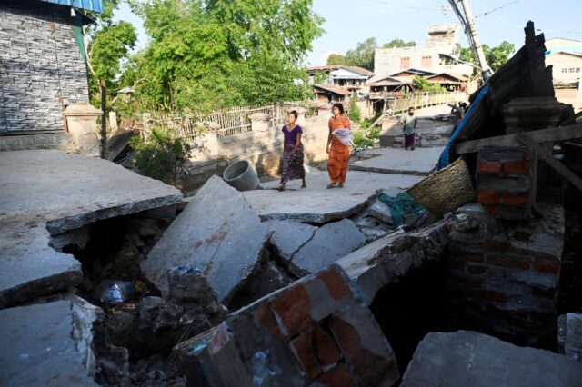 Thousands marked the start of Myanmar's water festival in the ruins of last month's earthq