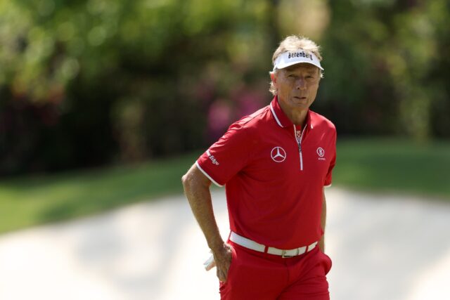 Two-time Masters winner Bernhard Langer walks off the 13th green after a bogey as the 67-y