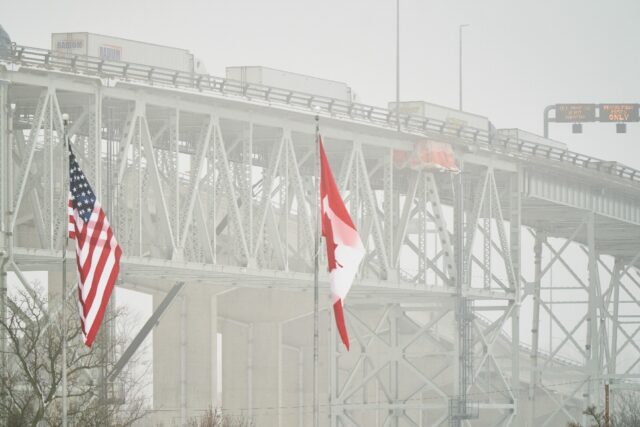 Trucks pass over the Blue Water Bridge at the border crossing with the US in Sarnia, Ontar