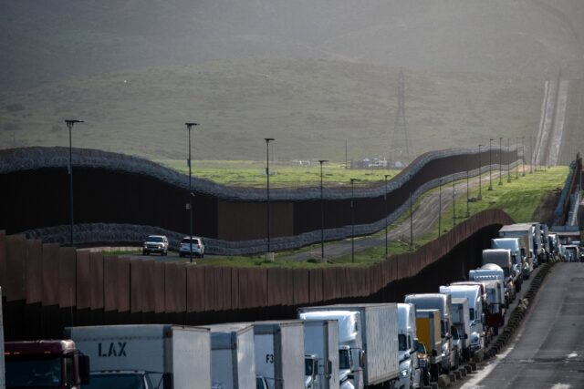 US-bound cargo trucks queue near the border in the Mexican city of Tijuana