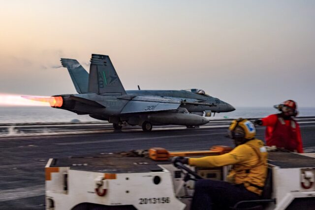 A US military photo shows an F/A-18 Super Hornet warplane taking off from the USS Harry S.